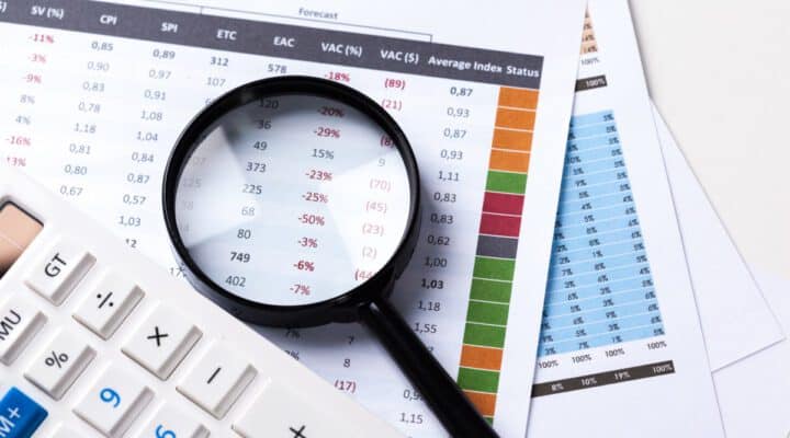 work with a magnifying glass, a calculator and papers